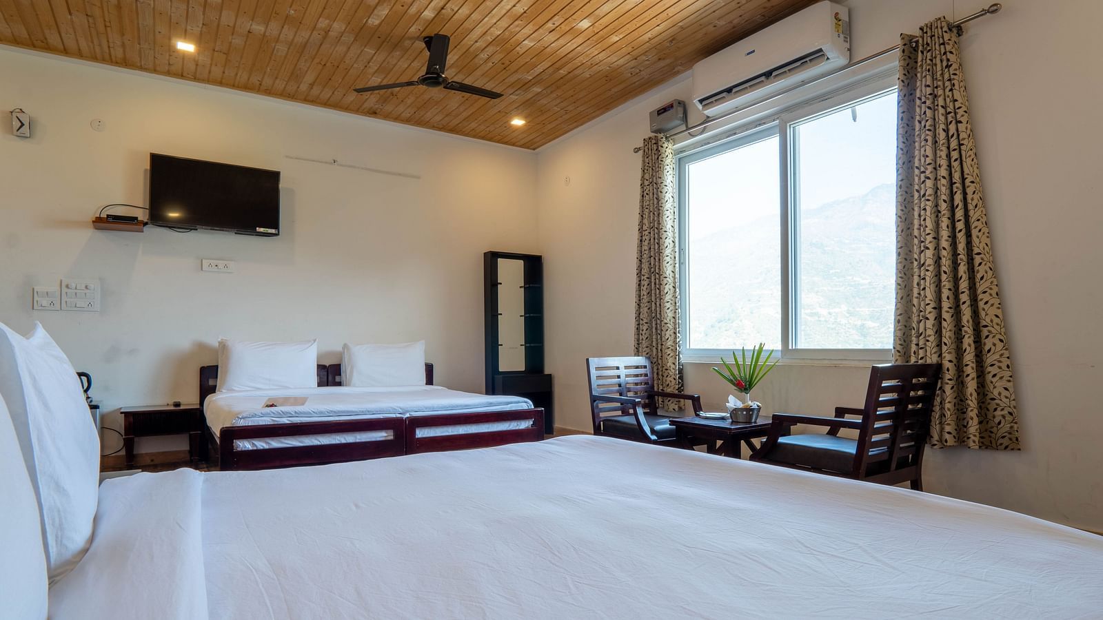 Family Room On Land closeup view of posh bedding and white duvet - Le ROI Floating Huts Eco Rooms3