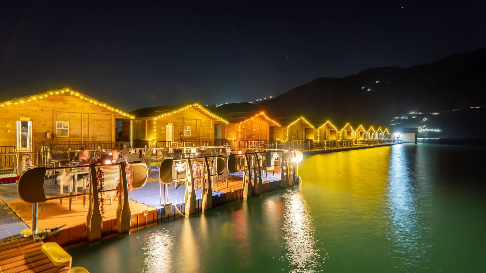 ariel and front view of the floating huts at Le ROI Floating Huts Eco Rooms captured during the day and at night3