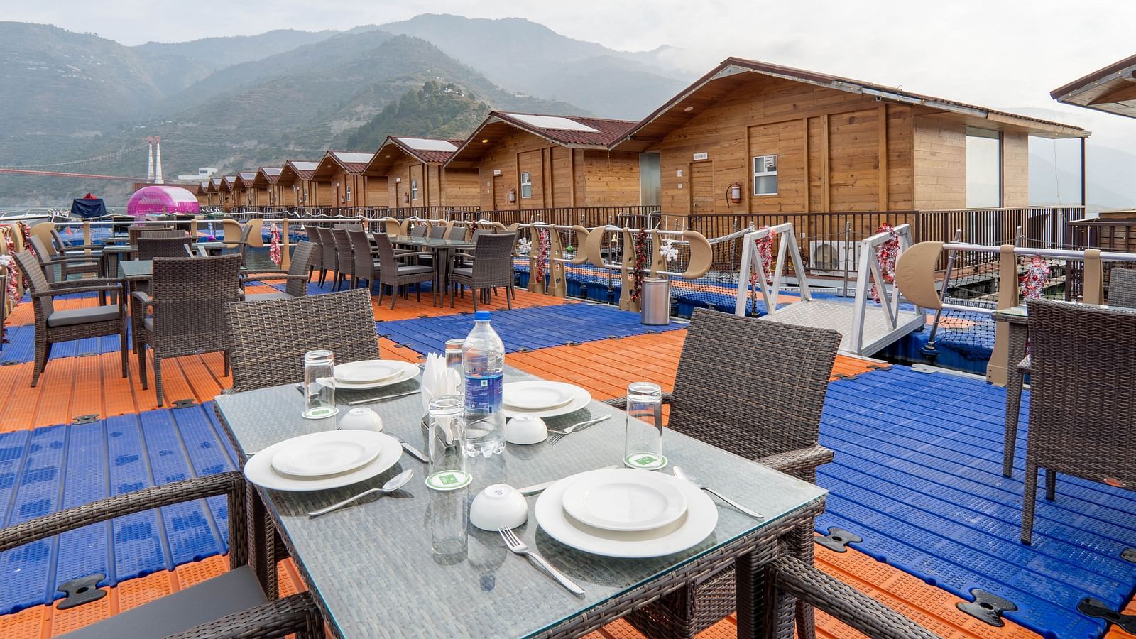 bedroom and dining area view at Floating Huts - Over the Lake captured during the day at Le ROI Floating Huts Eco Rooms1