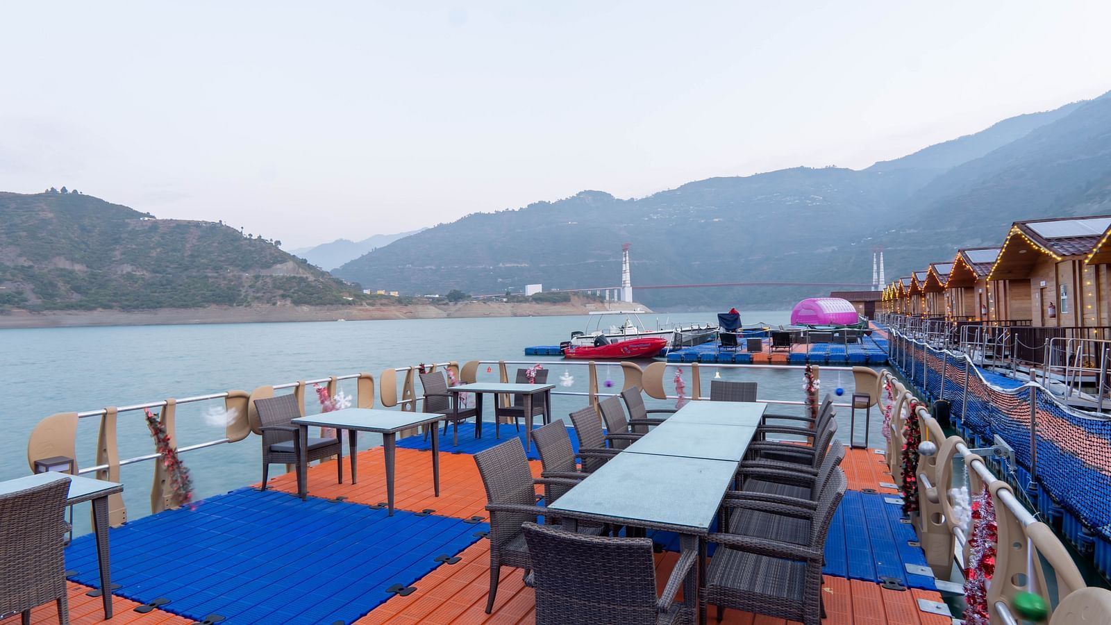 bedroom and dining area view at Floating Huts - Over the Lake captured during the day at Le ROI Floating Huts Eco Rooms4