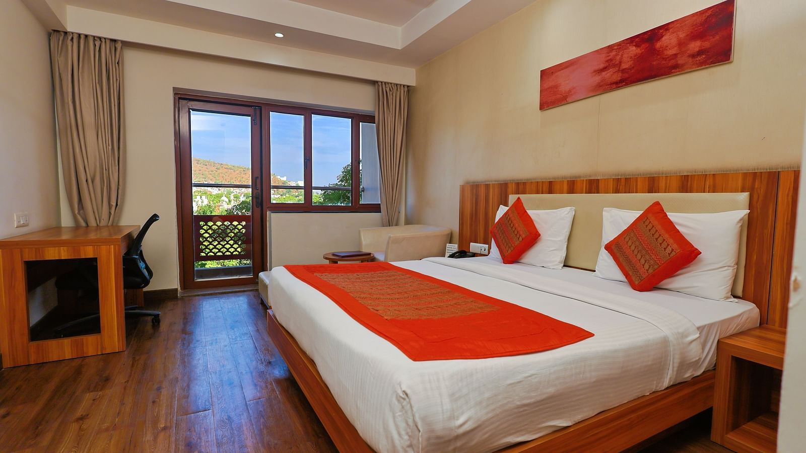 Golden Premium with Balcony and a pluhsy bed