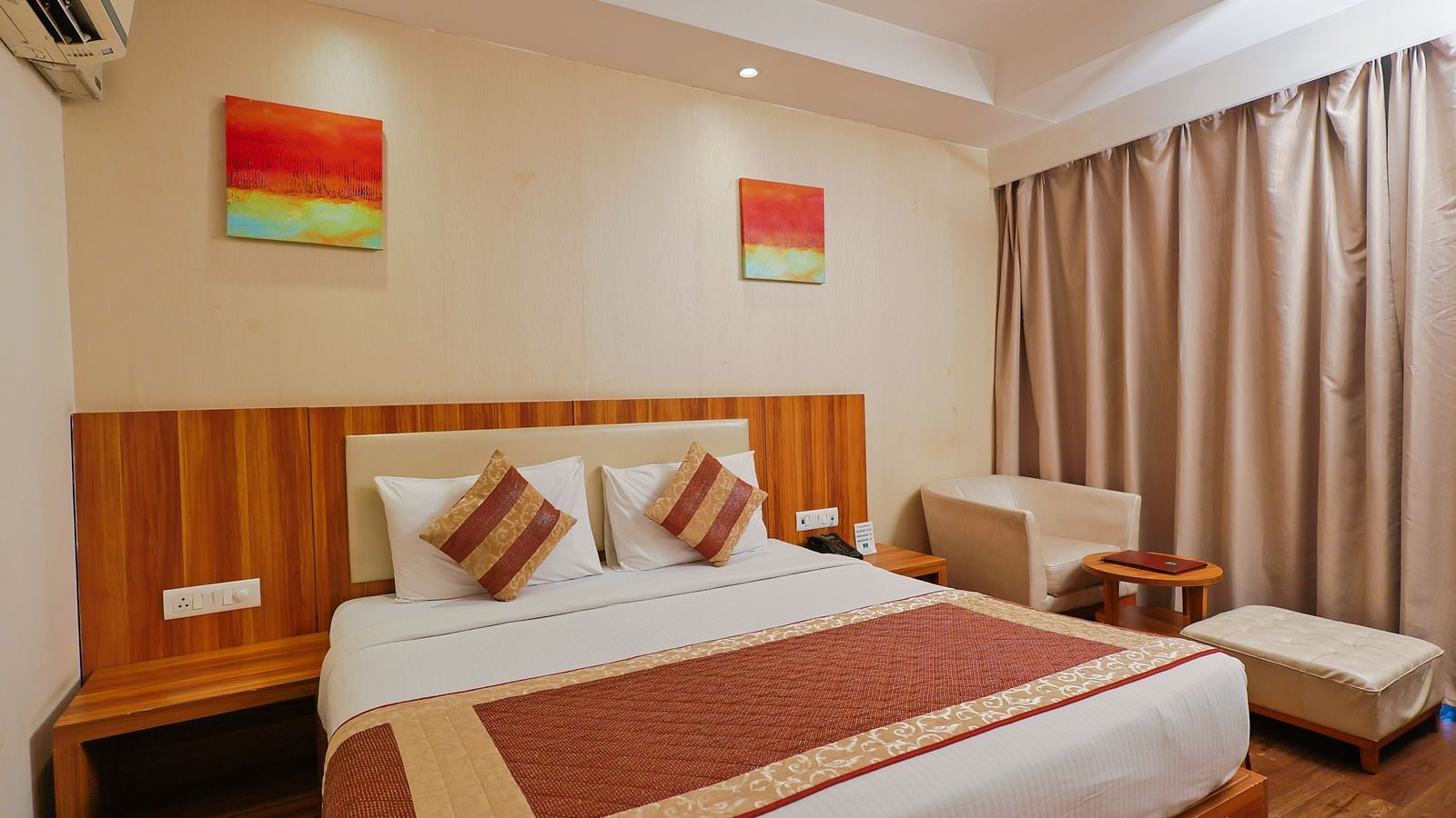 A front view of the bedrrom with the comfy bed and balcony.