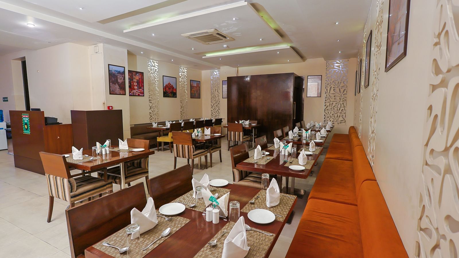 A restaurant with bright lighting that highlights the elegantly set table, ready for serving the culinary dishes
