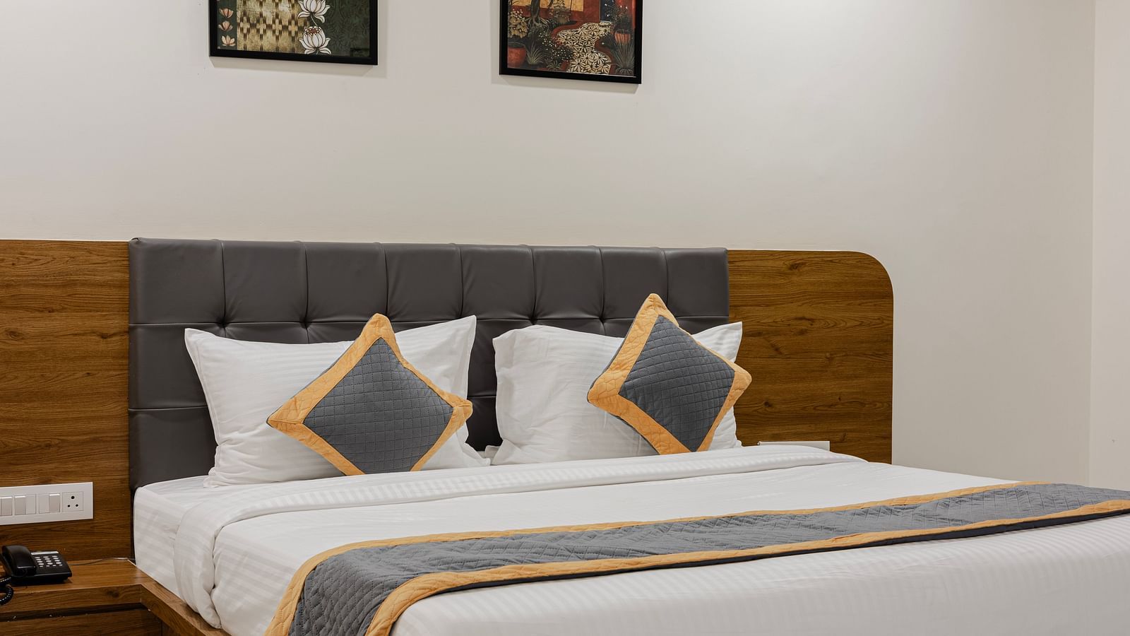 Premium  room with king-size bed and modern décor at Lemonridge Hotels, IDPL Balanagar.