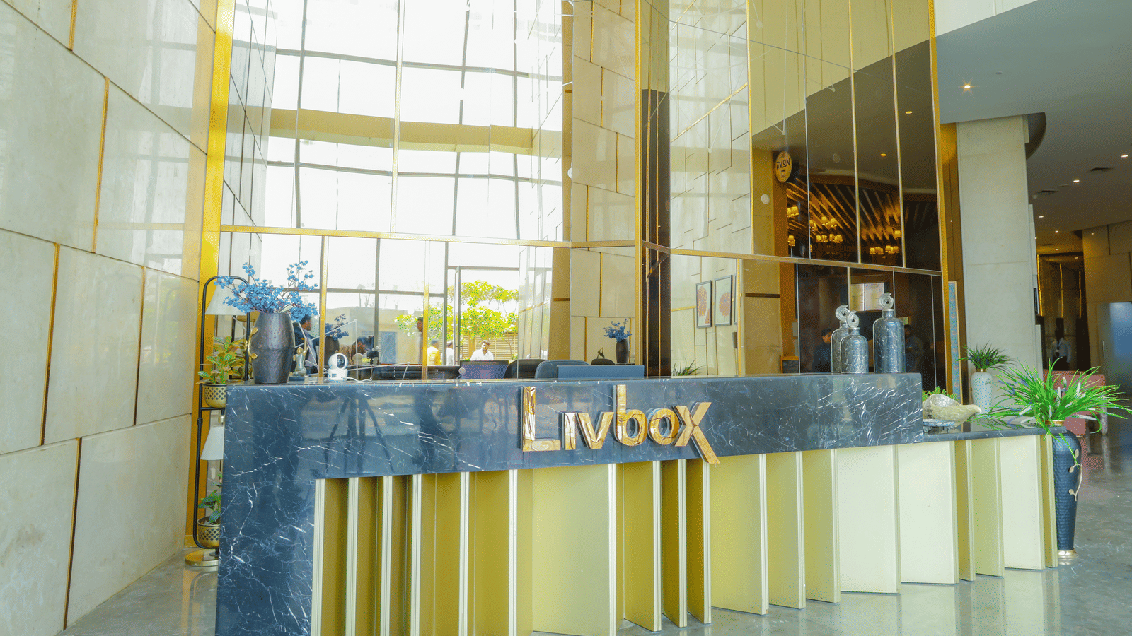 Reception desk at Livbox Supernova, Noida with modern, sleek interiors.