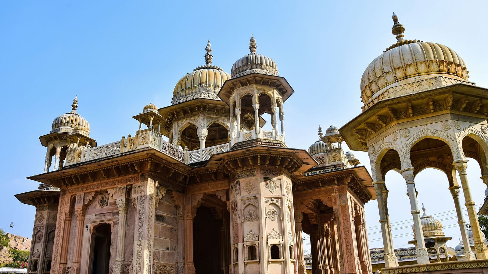 An overview of a temple in jodhpur with blue sky in the background