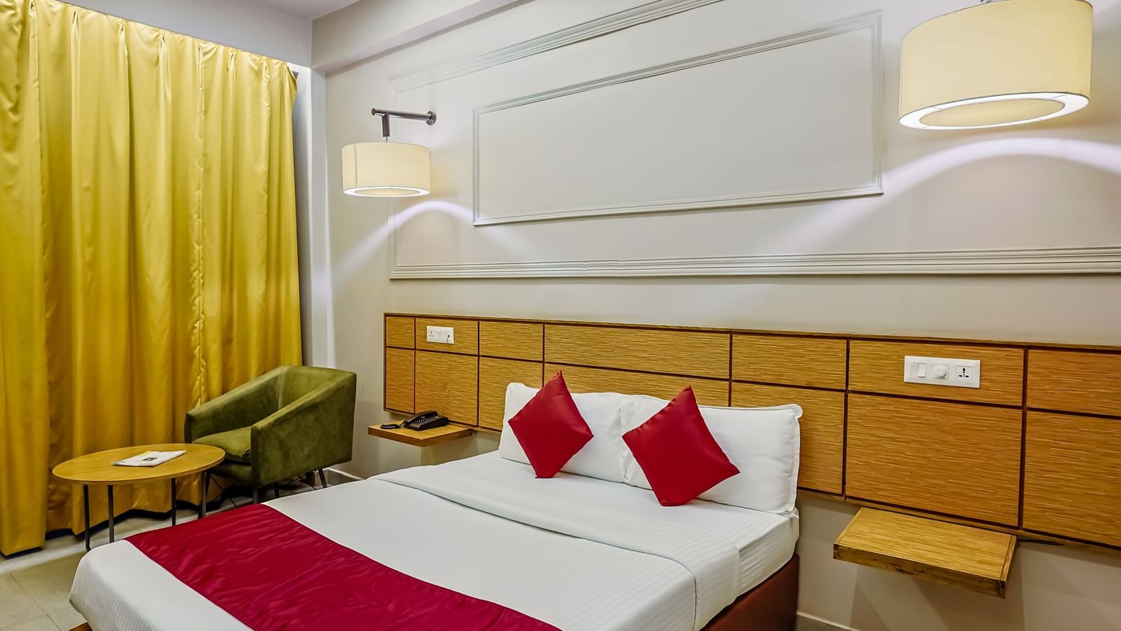Comfortable twin bedded room with bright decor at Max Hotel Prayagraj.