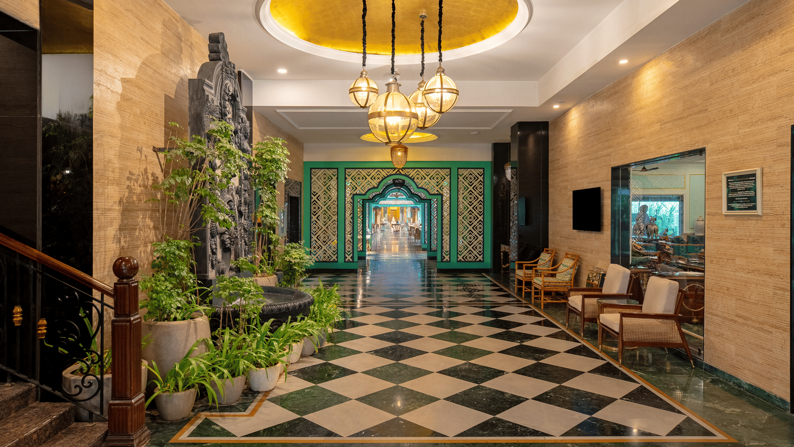 Hotel lobby with checkered flooring and chandelier at Mayfair Oasis Resort, Jharsuguda
