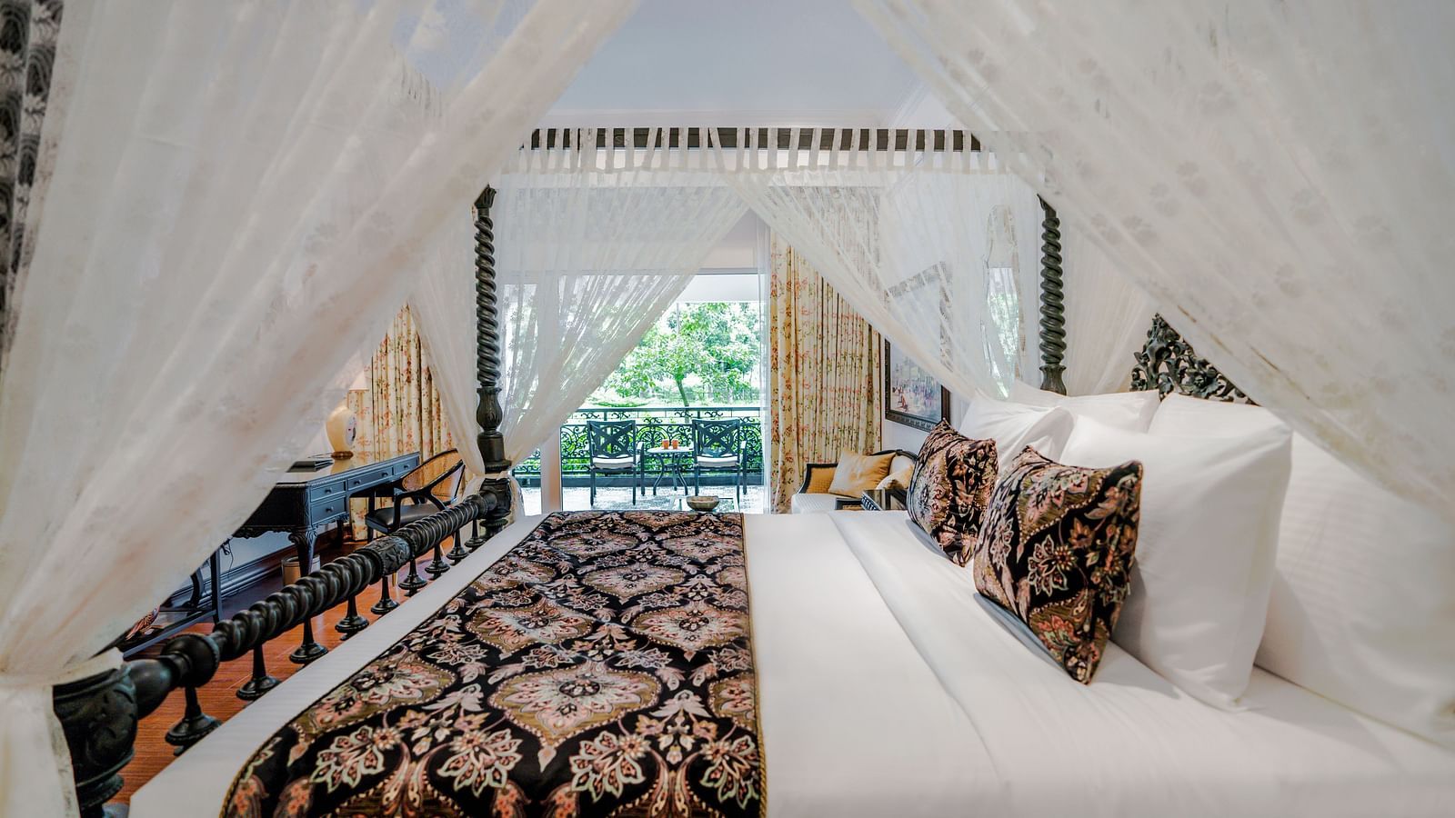 Bright and airy canopy bed suite with garden views at MAYFAIR Tea Resort, Siliguri