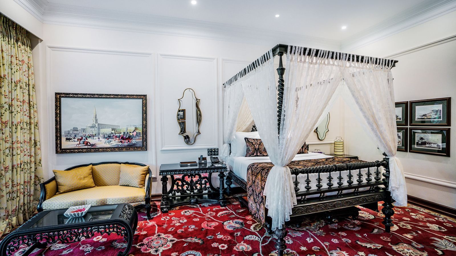 Charming suite with canopy bed and patterned carpet at MAYFAIR Tea Resort, Siliguri