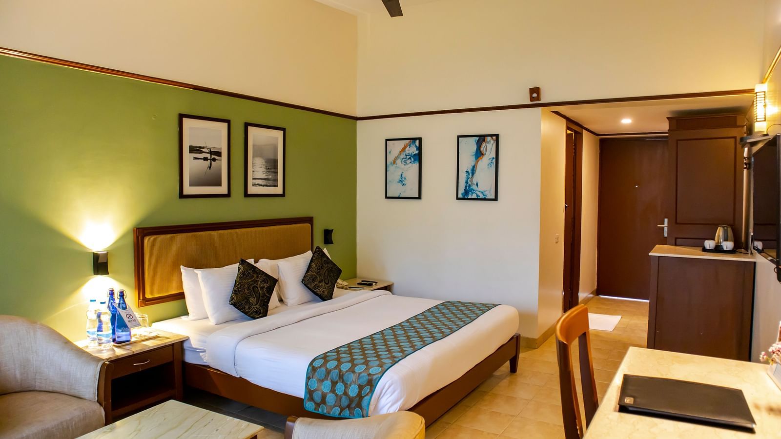 Interior of CLUB PREMIUM Room, featuring a bed, television and a seating area at MGM Beach Resorts 