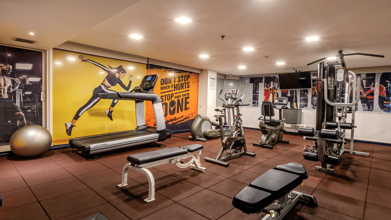 An overview of the fitness centre with many equipments in it - Night Hotel Bangkok.