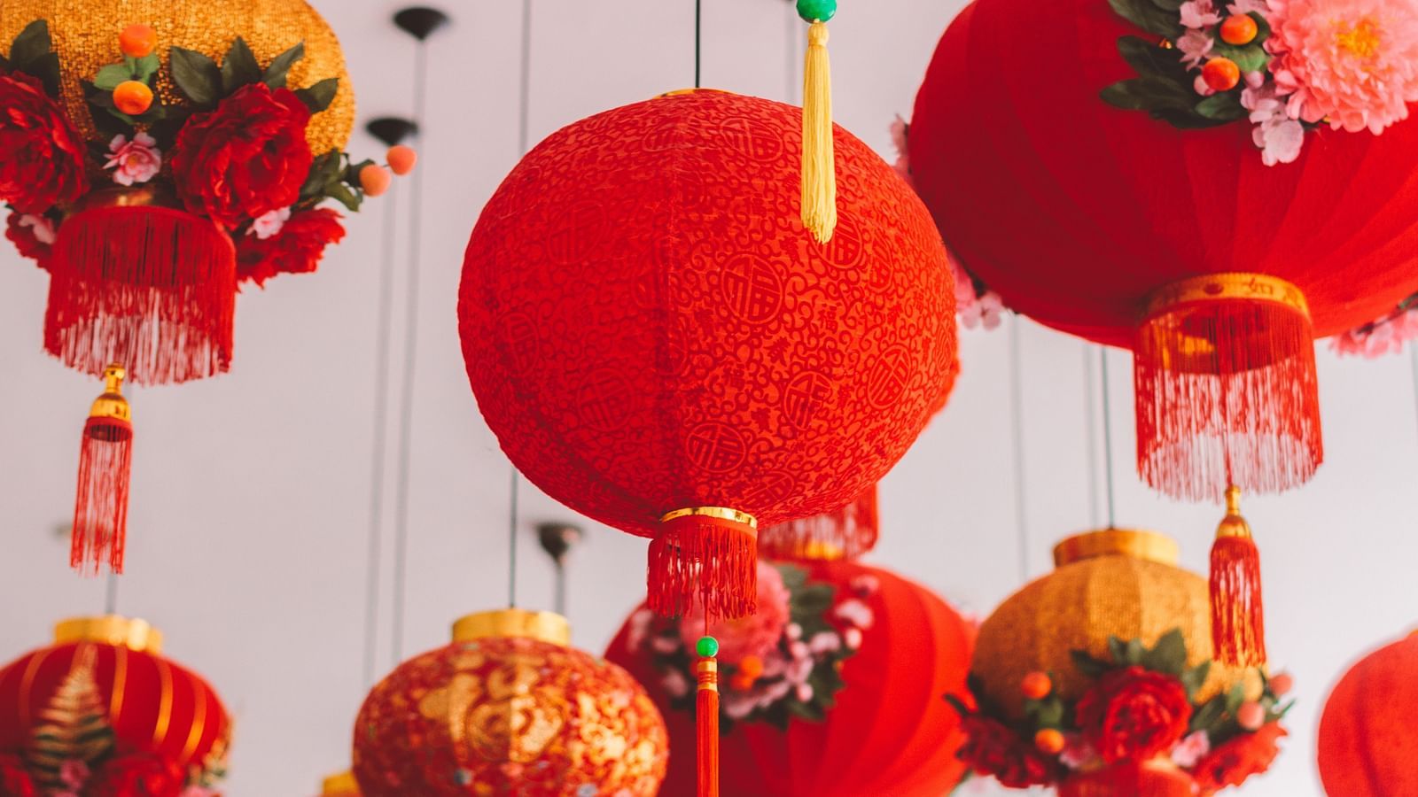 an image of red decorations hung above that is used for celebrations by Chinese people