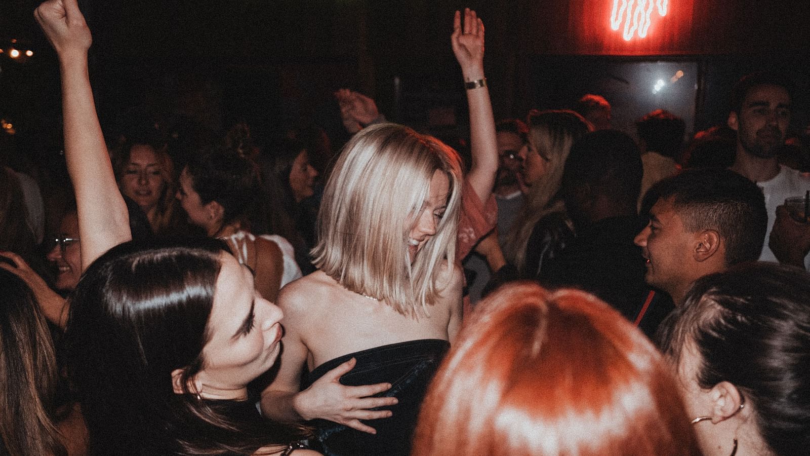 many people dancing the night away in the street