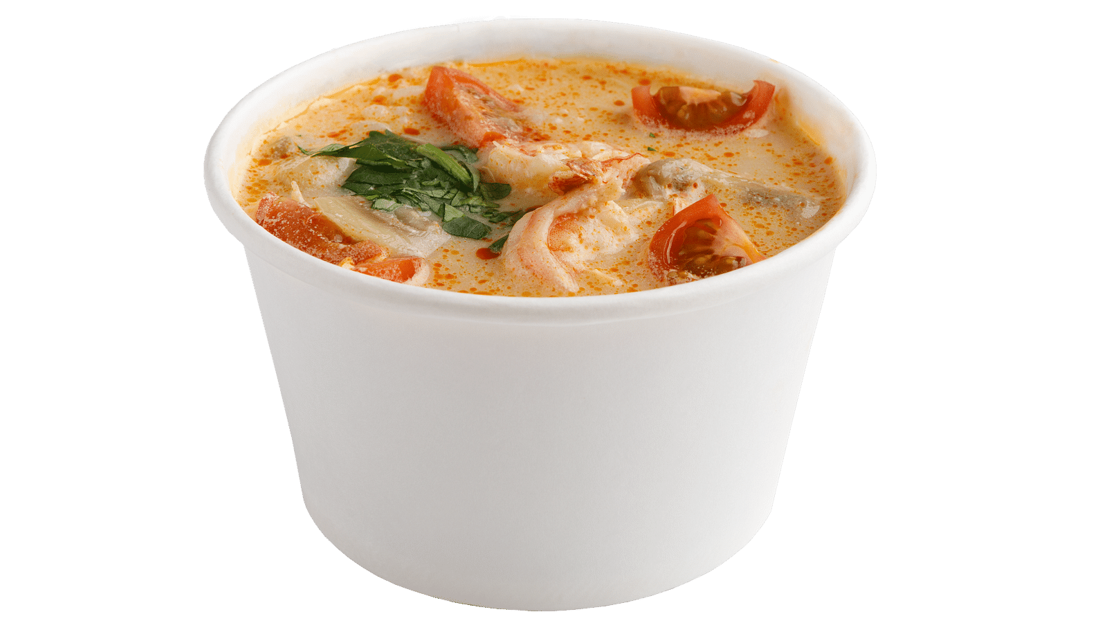 Side view of Tom Kha Kai kept in a white plastic container with tomatoes in view.