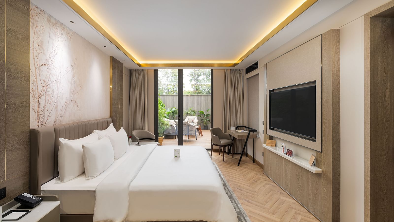 Comfortable Nirvana Suite bedroom furnished with two queen-size beds, tasteful decor, and ample natural light - Nirvana Luxury Hotel, Ludhiana