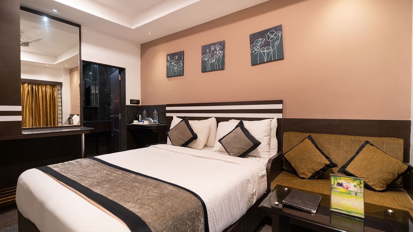 Image of a room with a bed with a mirror on the side at Parampara Resort & Spa, Kushalnagar.