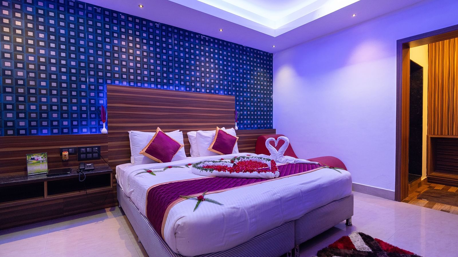 Image of a room with a bed and a rug placed in front of it at Parampara Resort & Spa, Kushalnagar.