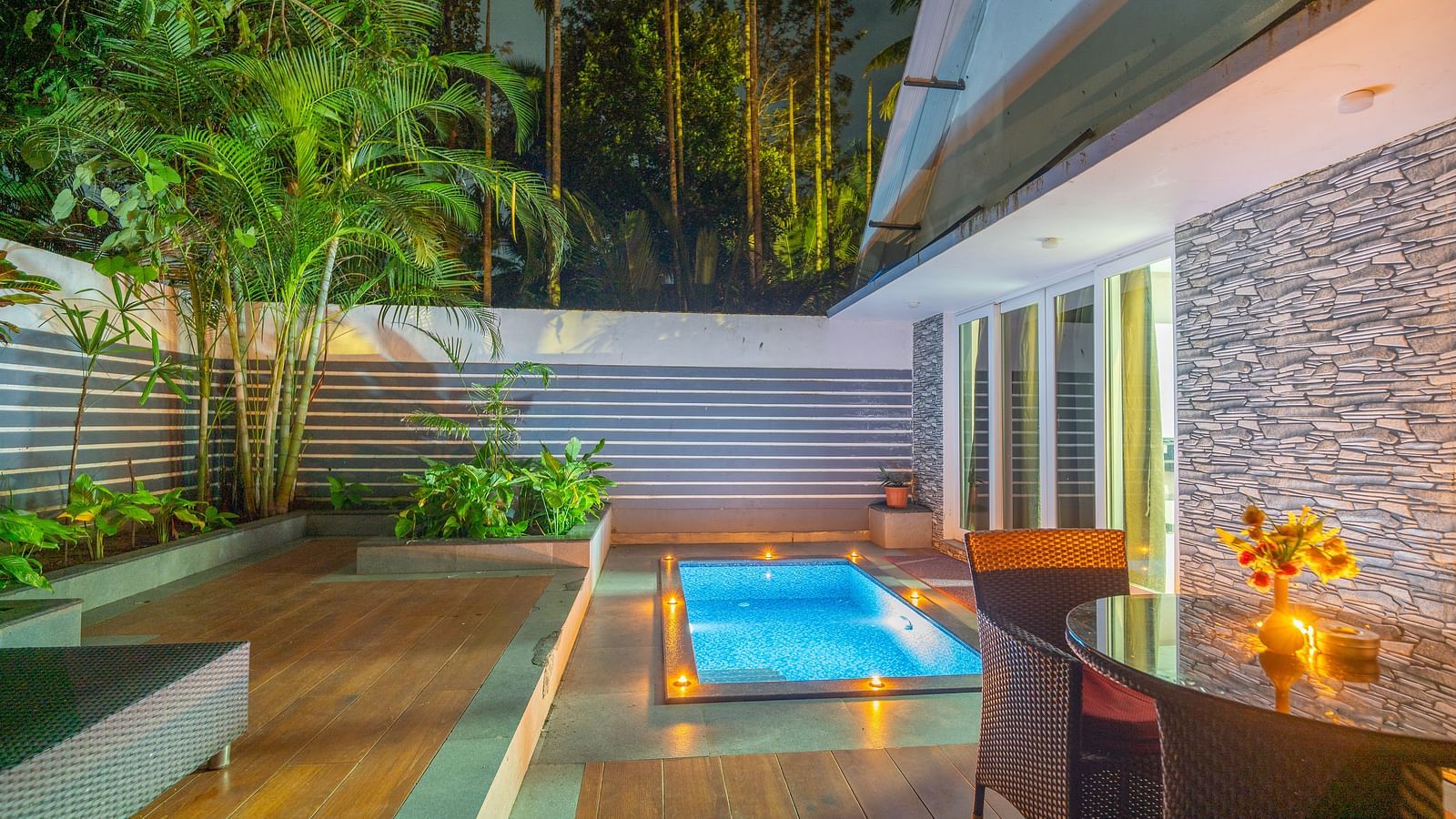 Image of a swimming pool outside an accommodation at Parampara Resort & Spa, Kushalnagar.