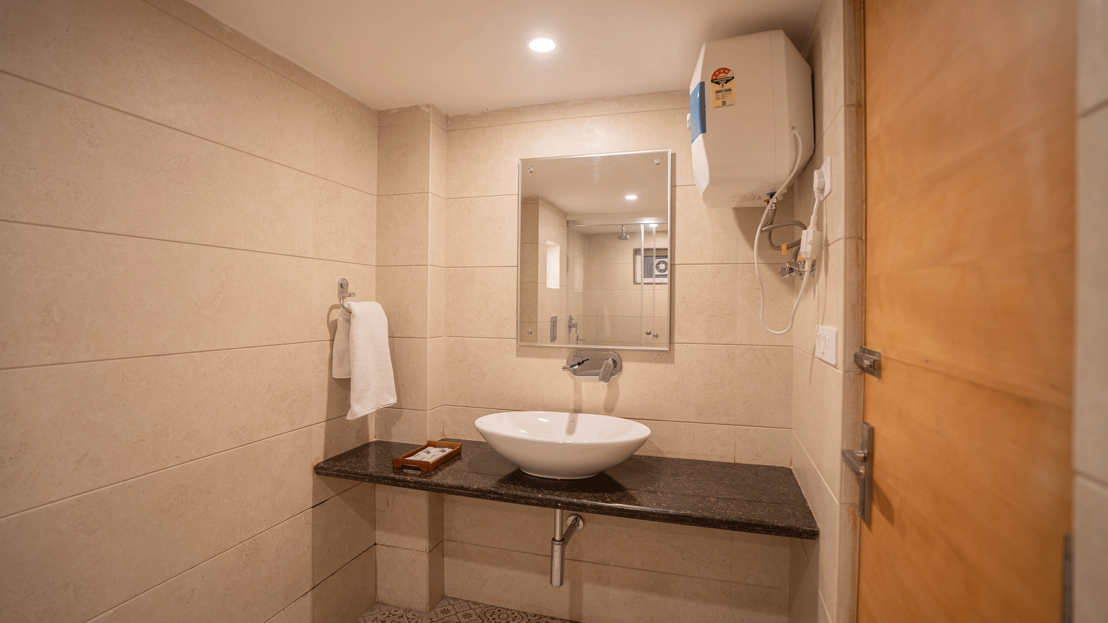 A bathroom with sink, mirror, and counter at Perfectstayz Premium at Mall Road Hotel Super, Mussoorie.