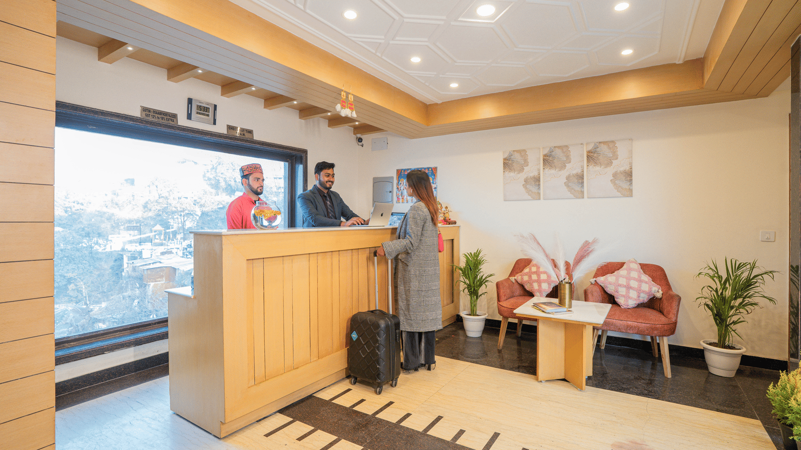 A hotel reception area with a desk and seating at Perfectstayz Premium at Mall Road Hotel Super, Mussoorie.