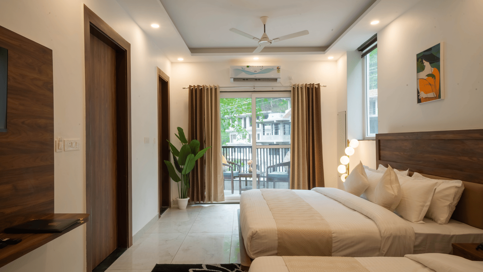 A room with 2 beds, a headboard, a wooden wardrobe, a fan on the ceiling, and a sliding glass door in Perfectstayz Premium Mystic Falls, Rishikesh.