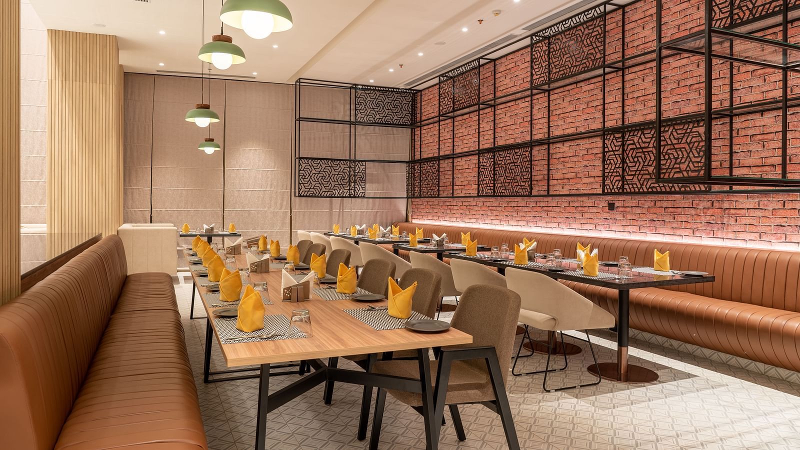 Dining setting with cutlery on a table at Ramada Encore, Bhiwadi.