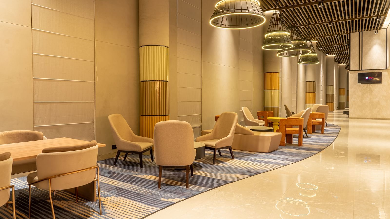 Sofa seating in the Tea Lounge at Ramada Encore, Bhiwadi.