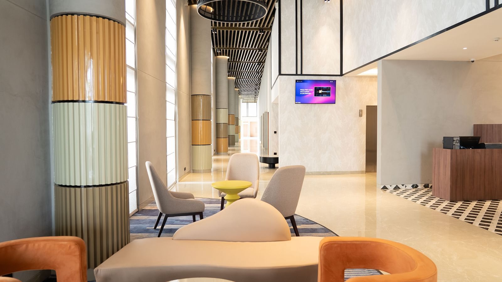 Sofa seating in the Tea Lounge at Ramada Encore, Bhiwadi.