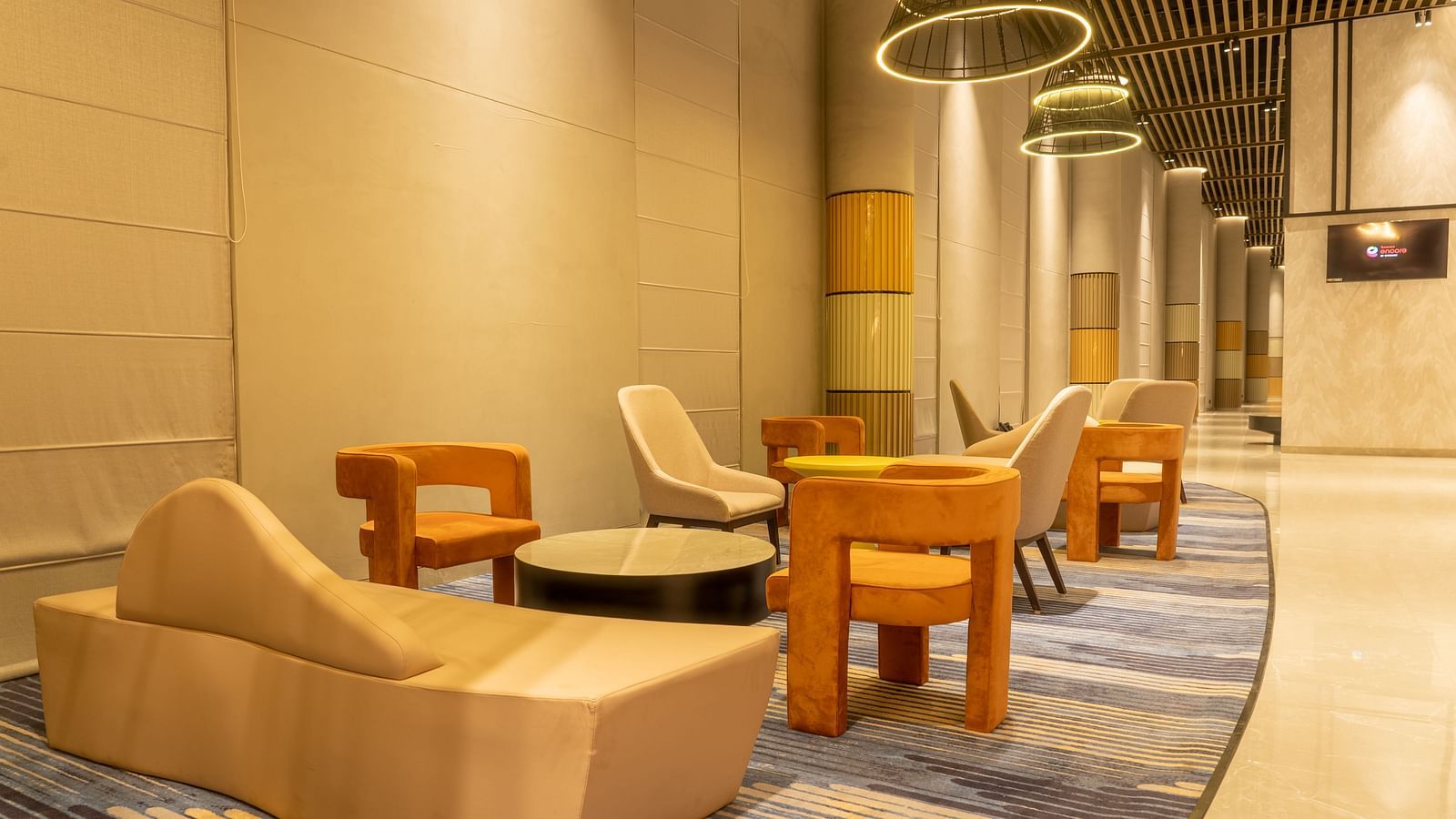 Sofa seating in the Tea Lounge at Ramada Encore, Bhiwadi.