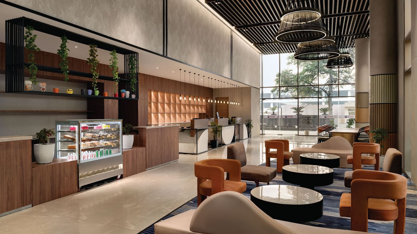 Ramada Encore by Wyndham, Bhiwadi | Hotel lounge with modern seating, decorative lighting, and a view of the lobby.
