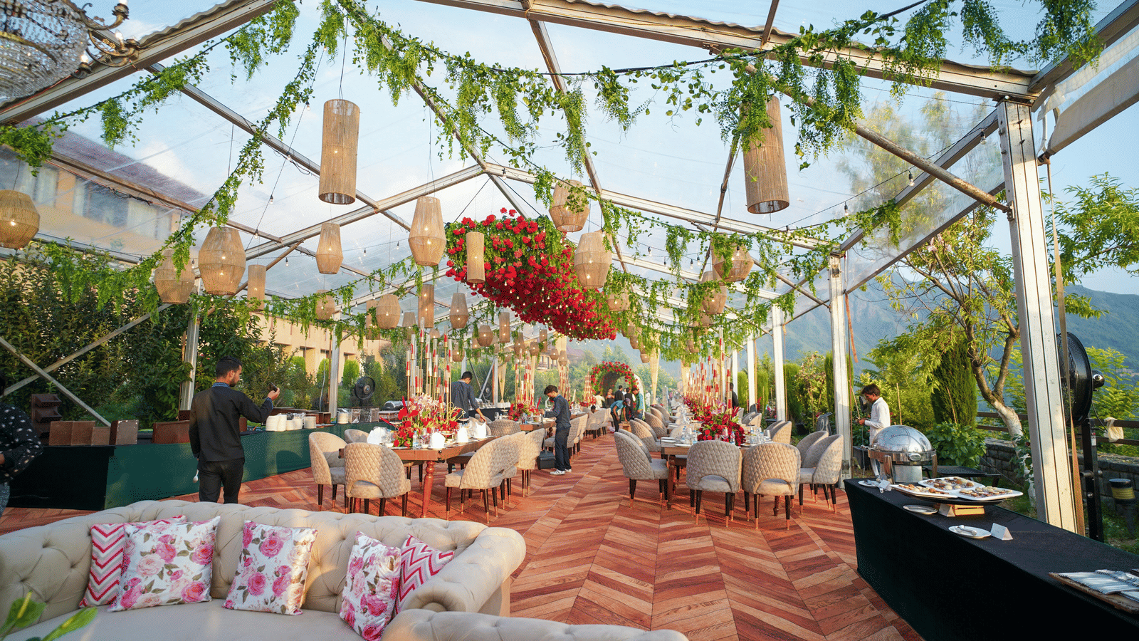 People preparing the banquet hall for an outdoor wedding