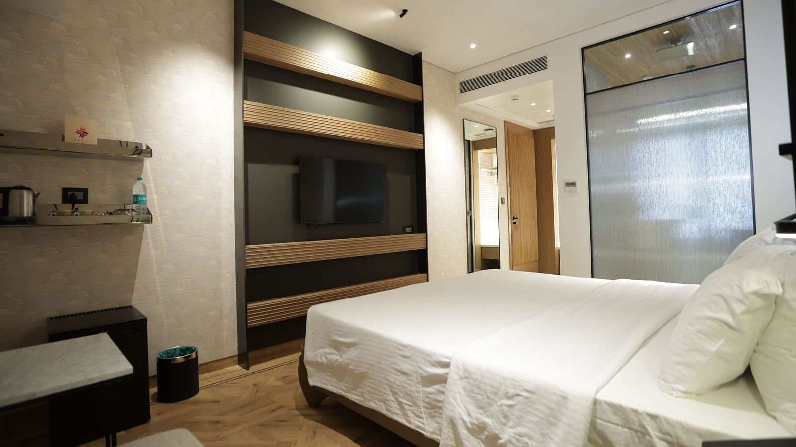 Premium accommodation at Regency Hotel, Mumbai featuring comfortable bedding, entertainment system, modern amenities and sophisticated interior design for guests.