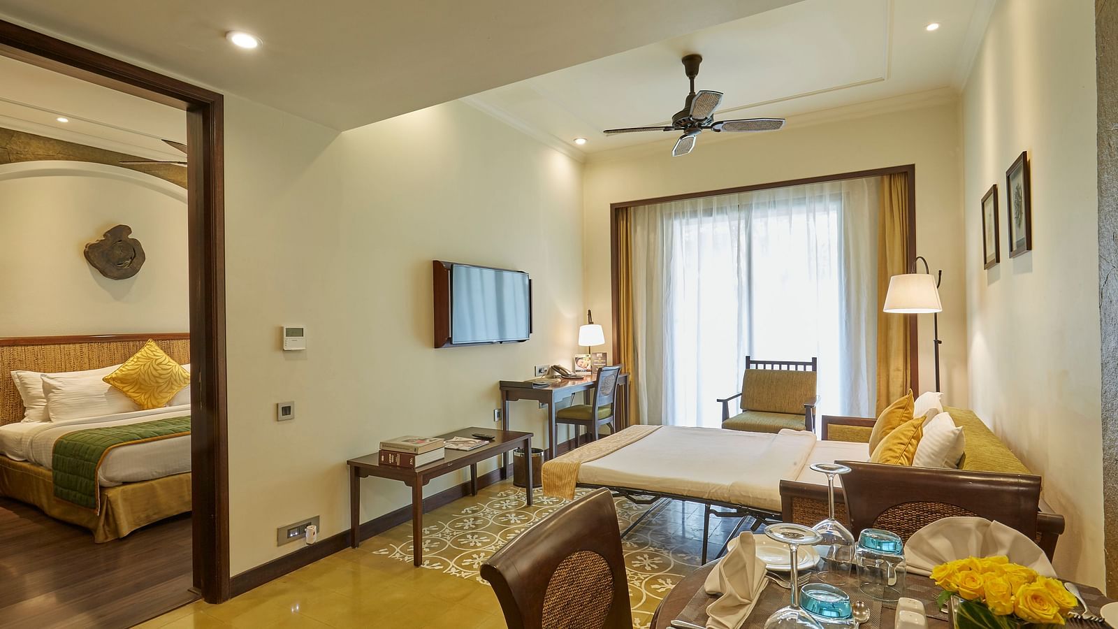 The interiors of the resort bedroom features a Banyan Sofa Bed - Rhythm Lonavala