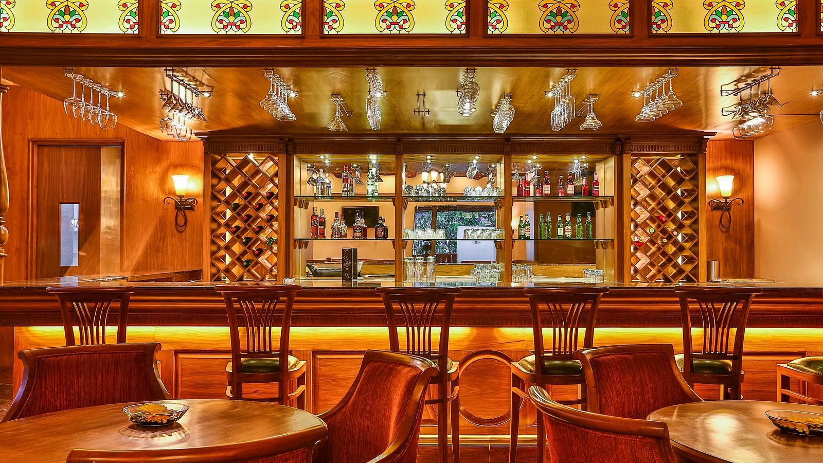 an image of Cedar Lounge bar with well-lit interiors at Rhythm Lonavala