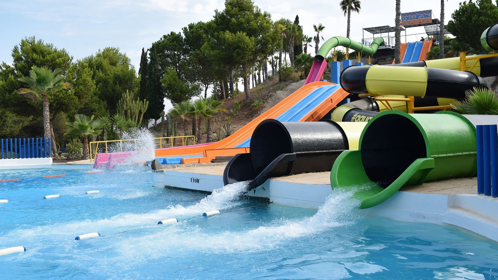an overview of a ride at a water park with water pouring out of the tubes - Adventure Sports in Lonavala