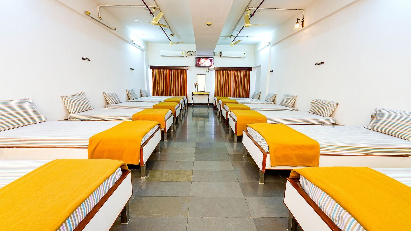 An upgraded dormitory with single beds at Sahara - Comfortable Dormitories in Hyderabad.