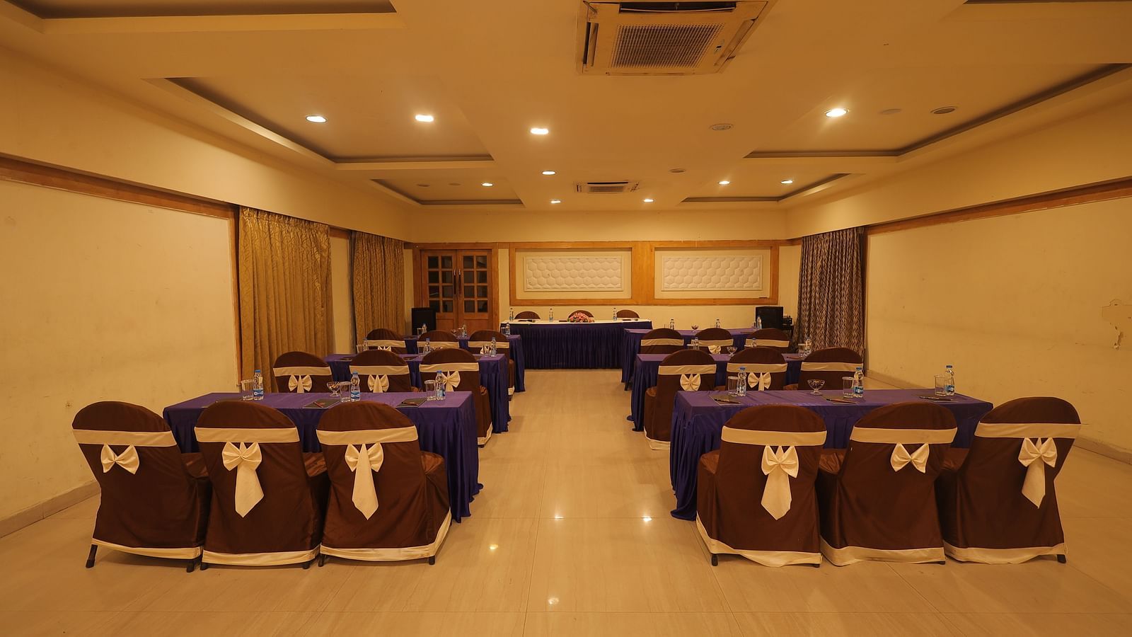 A banquet hall with seating arrangement
