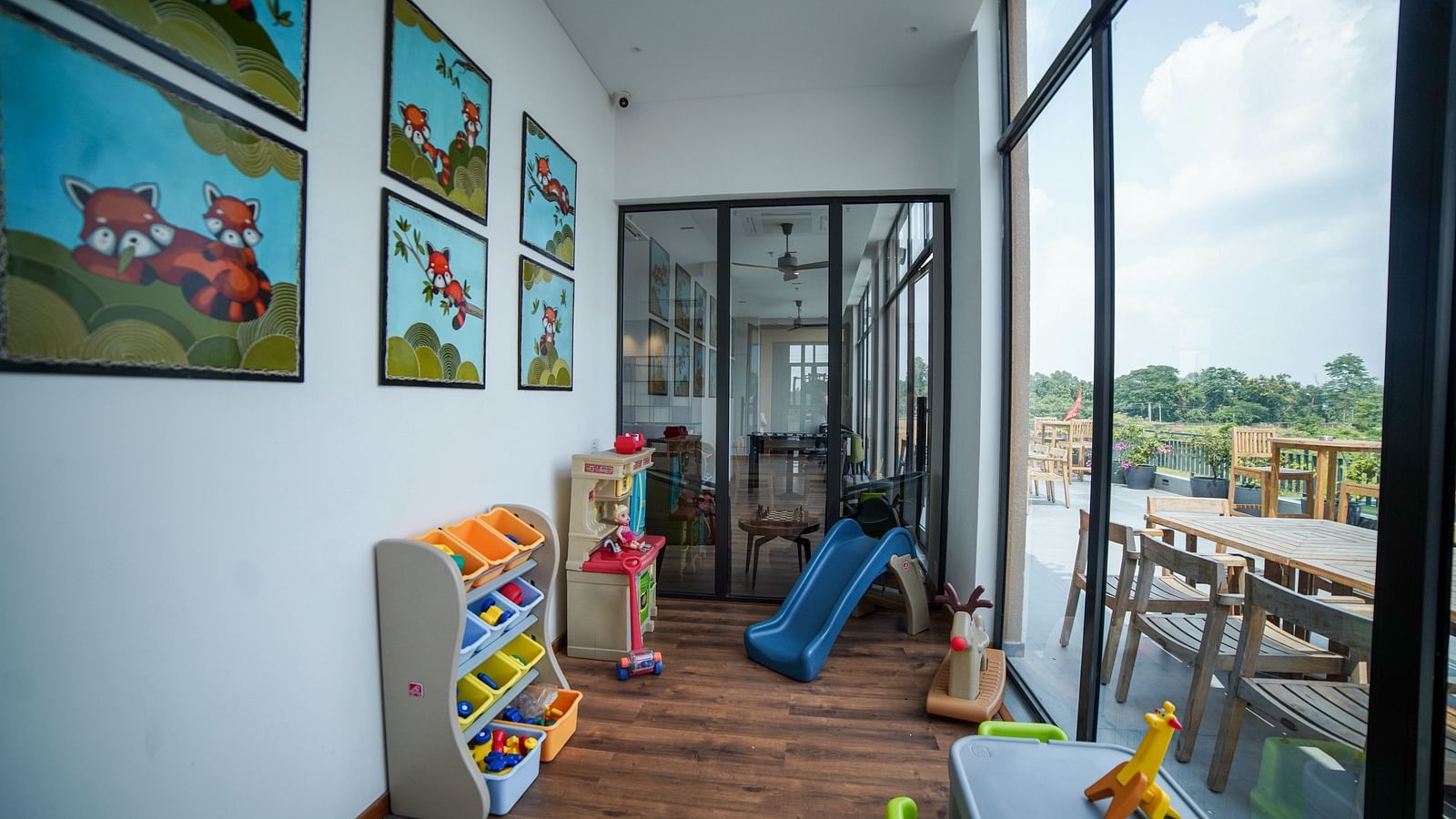 Kids play area at Singalila Club with large French windows letting in light during the day