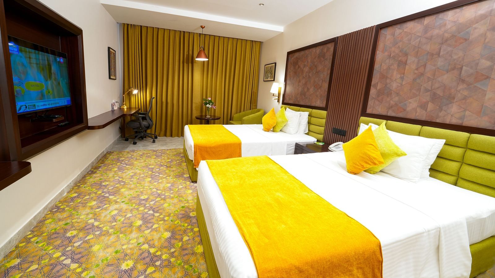Room at Sitara Luxury Hotel in Hyderabad near Ramoji Film City with a double bed and a television