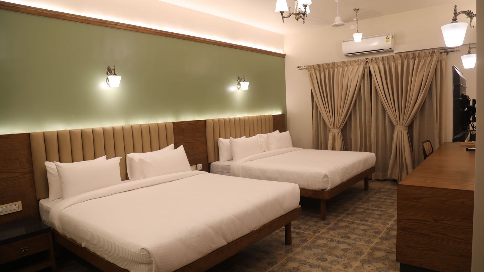two double beds inside one of the Heritage Suites at Summer House, Nandi Hills