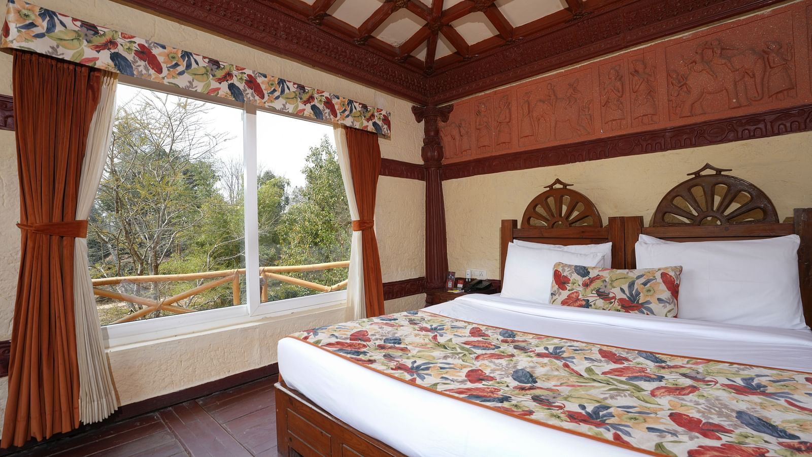 Ethnic villa featuring a spacious bed at Summit Green Lake Tea Resort & Spa, Kaziranga