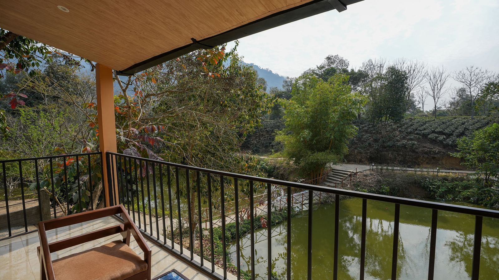 Premium room with balcony featuring lake view at Summit Green Lake Tea Resort & Spa, Kaziranga
