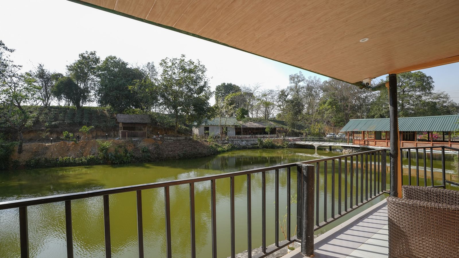 The duplex room with balcony offers breathtaking views of the lake and surrounding nature at Summit Green Lake Tea Resort & Spa, Kaziranga