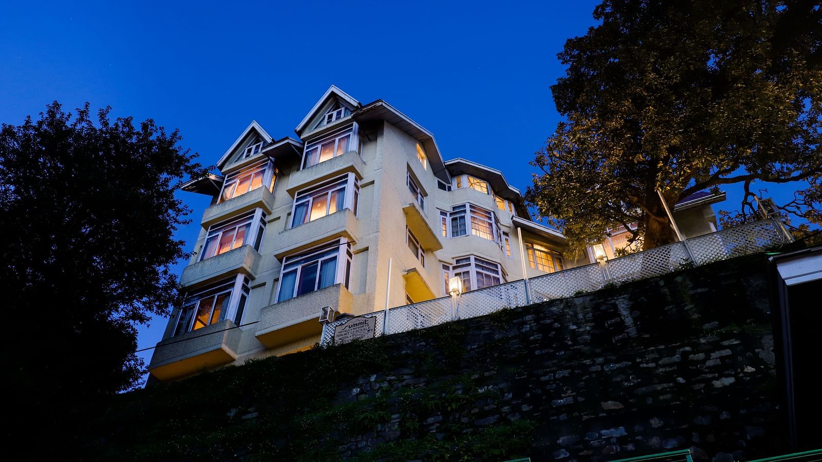 Nighttime exterior view of Summit Le Royale Hotel, Shimla