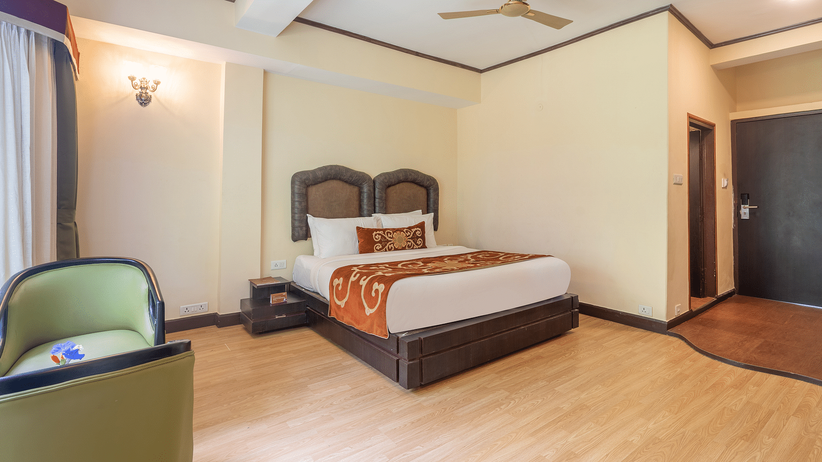 king size bed  of deluxe bed at Summit Lillium Hotel & Spa, Kalimpong