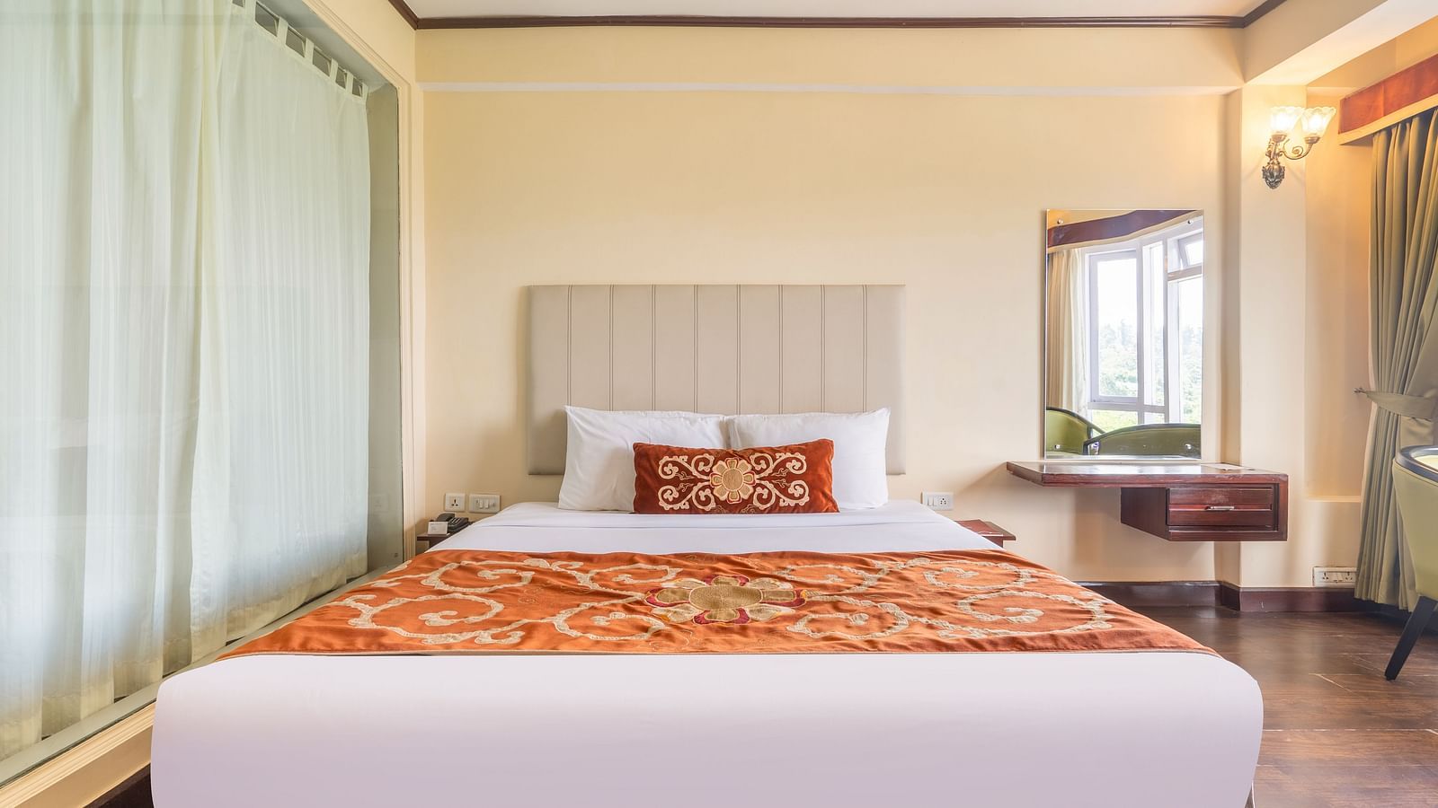 king size bed of premium room at Summit Lillium Hotel & Spa, Kalimpong