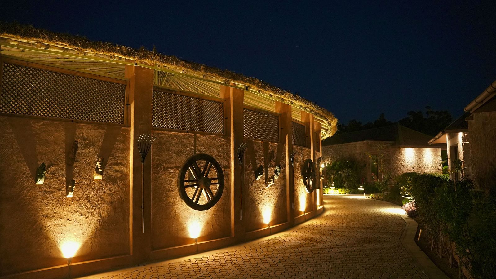 A pathway with lights on once side at Surpura Bagh.