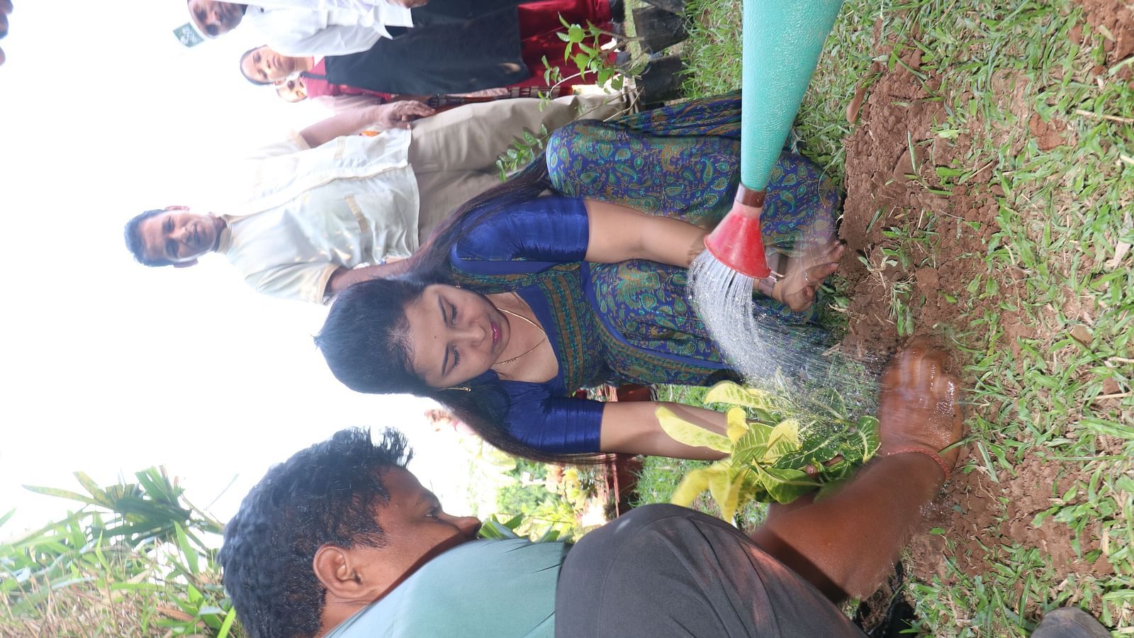 People planting and watering saplings at Swosti Resorts