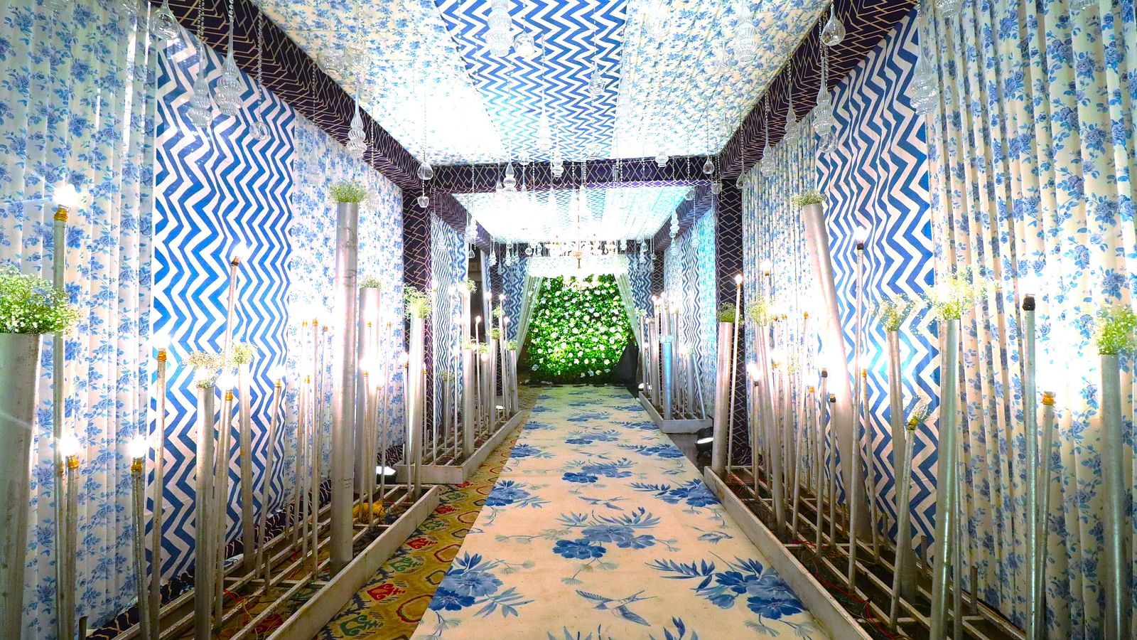 Banquet hall brightly lit and adorned with decorations throughout, perfectly set up for celebrations.